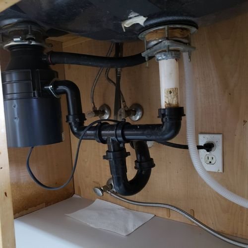 Full under-sink plumbing with new disposal and P-trap