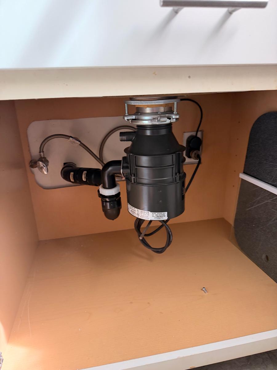 Badger disposal installed in a white cabinet – Los Feliz